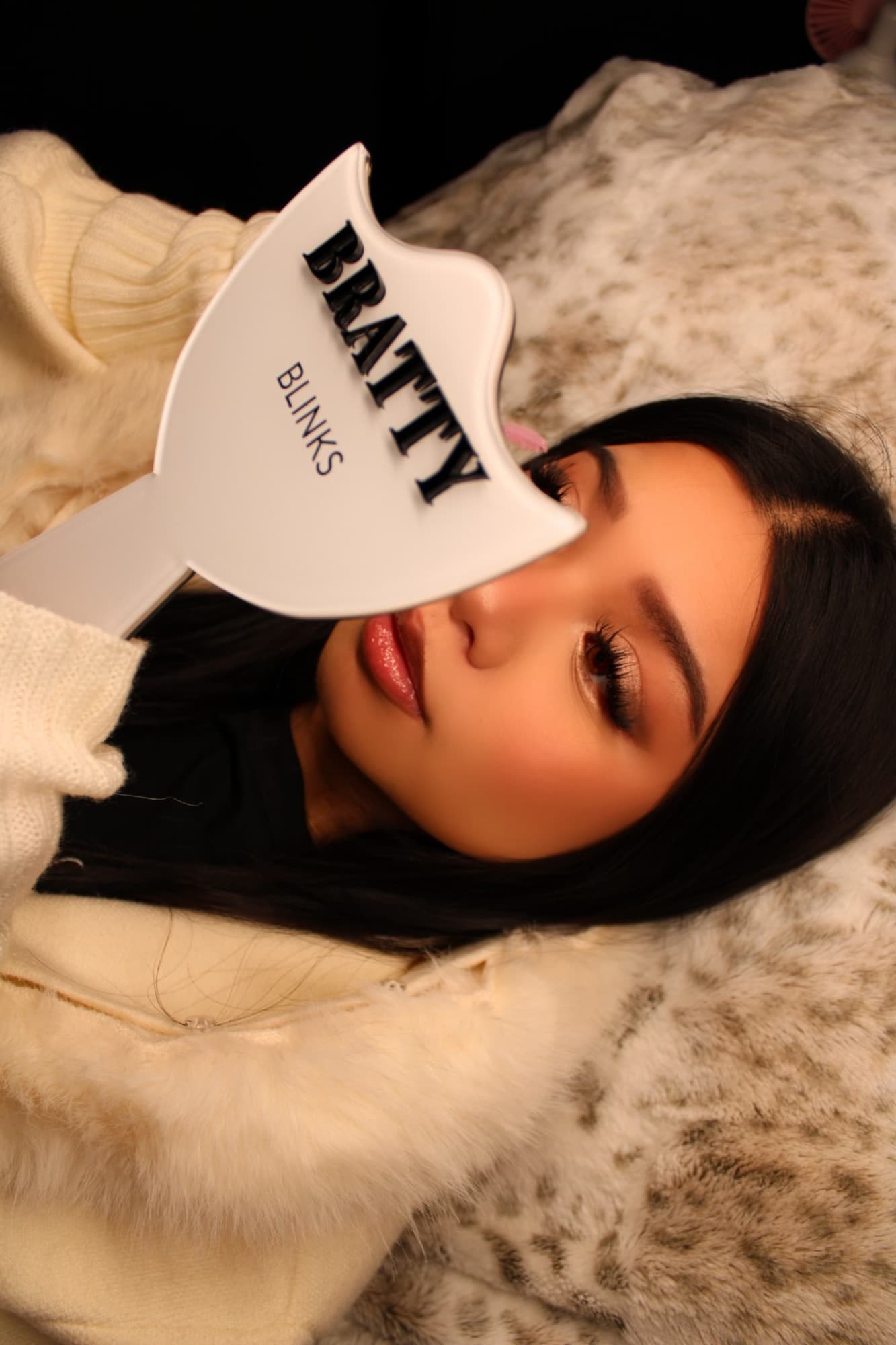 Close-up editorial portrait showcasing the Snowy Angel lash set